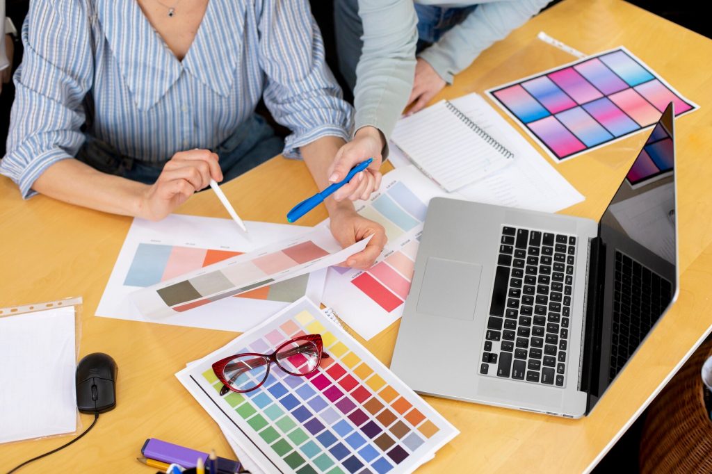 Color matching in office - Woman working with color swatches